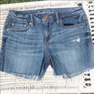 AE Cut off distressed stretch blue jeans s…
